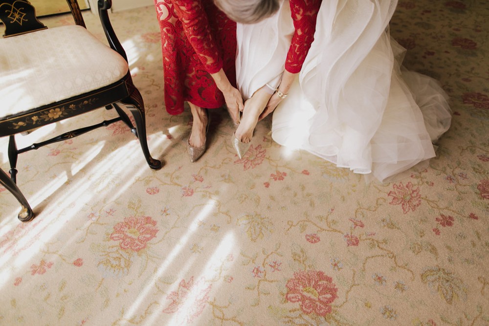 bride-getting-ready-gown-shoes