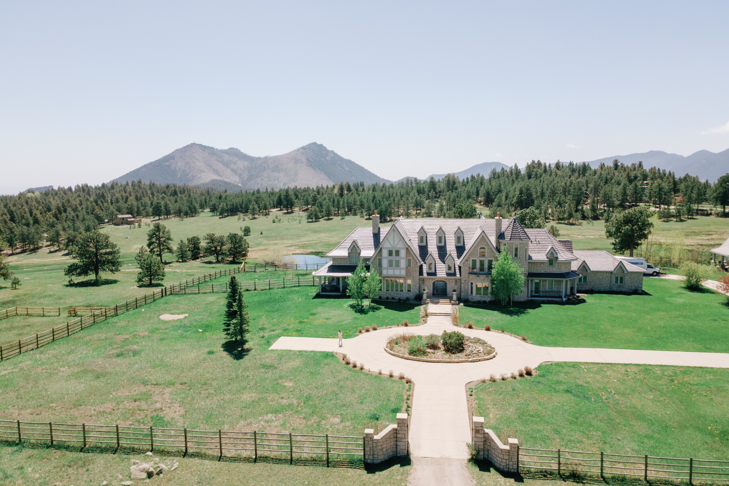 A large estate with meadows and mountain views with a castle-like home for rents for weddings named Greystone Castle near Boulder, Colorado