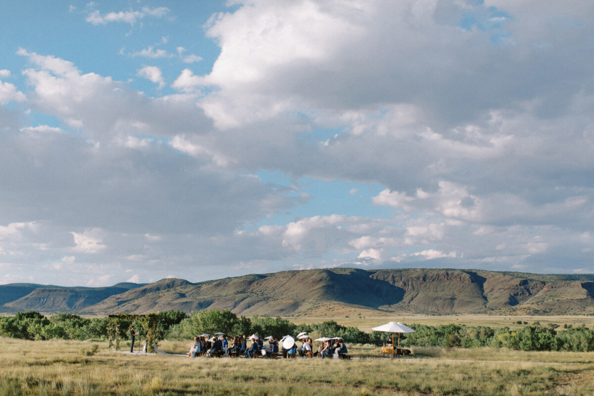 Santa Fe Wedding Venues: a wedding ceremony overlooking the mountains on private property